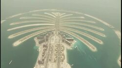 The man-made archipelagos of Palm Jumeirah and the Palm Islands are seen from the air. Stock Footage