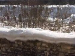 Eight days of meltng down snow on stone fence Stock Footage