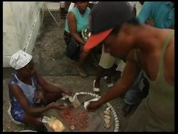 Aid effort faces ongoing challenges, market vendors resell bags of rice News Clip