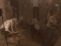 High Angle, static - Technicians work at an archaeological excavation site in Egypt Stock Footage