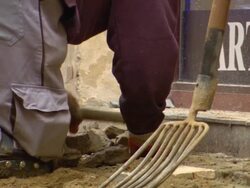 CU Shot of man working and placing stone at road Stock Footage