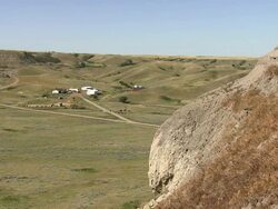 A cliff in the prairies with a beuatiful blue sky Stock Footage