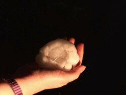 Person holding huge hailstone in hand, tennis ball sized hail stone, giant hail, MS, South Plains, Texas, USA Stock Footage
