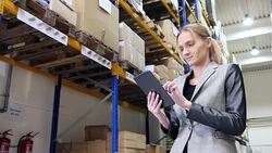 Attractive manager working on tablet in warehouse Stock Footage