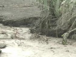 River full of volcanic ash flows near Merapi volcano after large eruption; Indonesia. 7 November 2010 / AUDIO Stock Footage