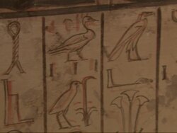 Close Up, pan-left - A mural depicts Egyptian figures and hieroglyphics Stock Footage