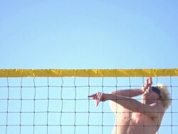 A man spiking a beach volleyball. - Slow Motion - filmed at 240 fps Stock Footage