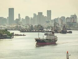 Cargo ship on the River in a big city Stock Footage