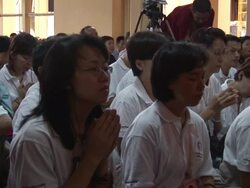 MS People seated on ground praying silently in large group AUDIO / Dharamsala, Himachal Pradesh, India Stock Footage