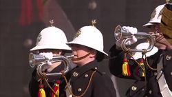 Trumpet Player & Marching Band at War Memorial News Clip
