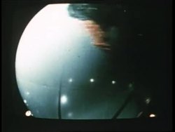 A globe spins against a black background. News Clip