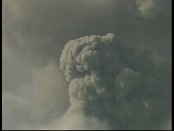 CU grey smoke and ash cloud billow from crater into white sky, tilt up billowing a column of smoke and ash, Mount Tunguragua, Ecuador Stock Footage