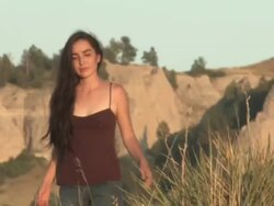 MS ZO American Indian young woman walking on great plains in grass / Pine Ridge, South Dakota, United States    Stock Footage