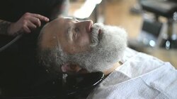 Barber hand wash head elderly clients Stock Footage