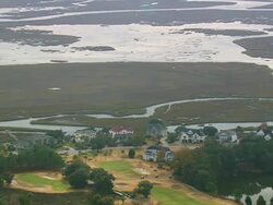 MS AERIAL TS Shot of houses with trees at near estuary / South Carolina, United States Stock Footage