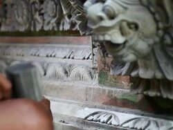 MS R/F Shot of man working on stone sculpture / Ubud, Bali, Indonesia Stock Footage