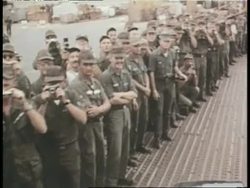 U.S. President Lyndon B. Johnson and General William Westmoreland greet U.S. soldiers on a military base in Vietnam. News Clip