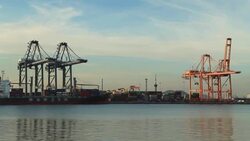 Industrial port with containers ship in the harbor Stock Footage