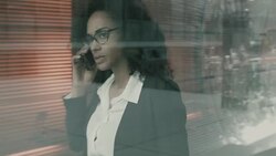 Business woman having discussion on mobile phone Stock Footage