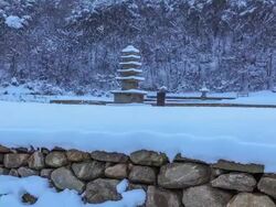 Snow scene of Bowonsajiocheungseoktap(Stone Pagoda, Korea Treasure 104) at Bowonsa Temple Site(Korea Historic Place 316) Stock Footage
