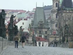 MS View of two men walking on charles bridge at early morning / Prague, Hlavni mesto Praha, Czech Republic Stock Footage