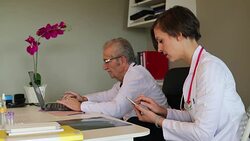 Professor and assistant doctor  working at small clinic Stock Footage