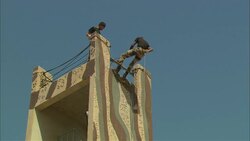 Soldiers rappel down a tall tower during a training exercise in Saudi Arabia. Stock Footage
