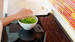 Beautiful chef preparing vegetables for organic salad Stock Footage