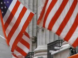 CU American Flag blowing in the wind at the New York Stock Exchange / New York City, New York State, USA  Stock Footage