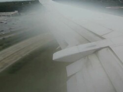 airplane landing with peculiar effect of turbulence Stock Footage