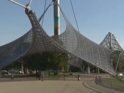 Olympiapark,  Park, skater, trees, walking people, sunny, blue sky Stock Footage