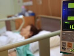 Patient in Hospital with Saline Solution Volumetric Infusion Pump Stock Footage
