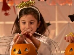 HD DOLLY: Taking Candies Out Of Pumpkins Stock Footage