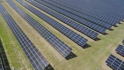 AERIAL Solar Power Station Flyover Shot (4K/UHD) Stock Footage