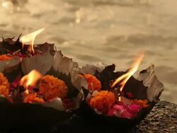Religious offering at riverbank, Ganges River, Haridwar, Uttarakhand, India Stock Footage