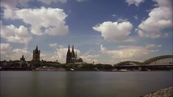 Clouds drift over the Rhine River and Hohenzollern Bridge. Stock Footage