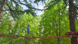 boy in the municipal rope park Stock Footage