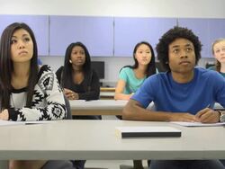 Confident Male Student Interacts in Classroom Setting Stock Footage