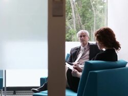 MS PAN businessman and businesswoman in discussion in office/Seattle, Washington, USA Stock Footage