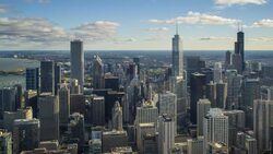 High angle view of Chicago skyline and suburbs looking south in the evening, Chicago, Illinois, USA. Stock Footage