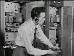 1951: EMERGENCY PREPAREDNESS: DRAMATIZATION: 'Jack' head console operator explaining what city services are on the Console to 'Colonel' Civil Defense Plan, The Red Scare, McCarthyism. Instructional Video