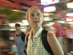 CU DS Woman in city street at night, Bangkok, Thailand Stock Footage