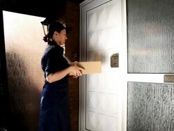 Delivery worker delivers packages Stock Footage