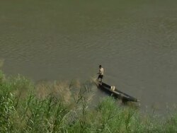 HA Man fishing Mekong River / Luang Prabang, Laos Stock Footage