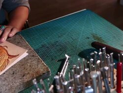 leatherworker paint  fish pattern on leather Stock Footage