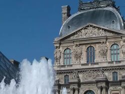  MS TD Louvre palace and pyramid with fountain in front of museum / Paris, France  Stock Footage