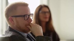MS Businessman in discussion with colleagues in office Stock Footage