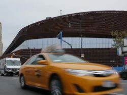 MS Shot of traffic moving in front of Barclays Center / New York, United States Stock Footage