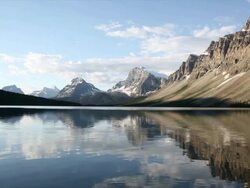 Gentle waves lap surface of mountain lake Stock Footage