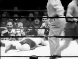 B/W 1948 Rocky Graziano falling in boxing match with Tony Zale / Rupert Stadium, Newark Stock Footage